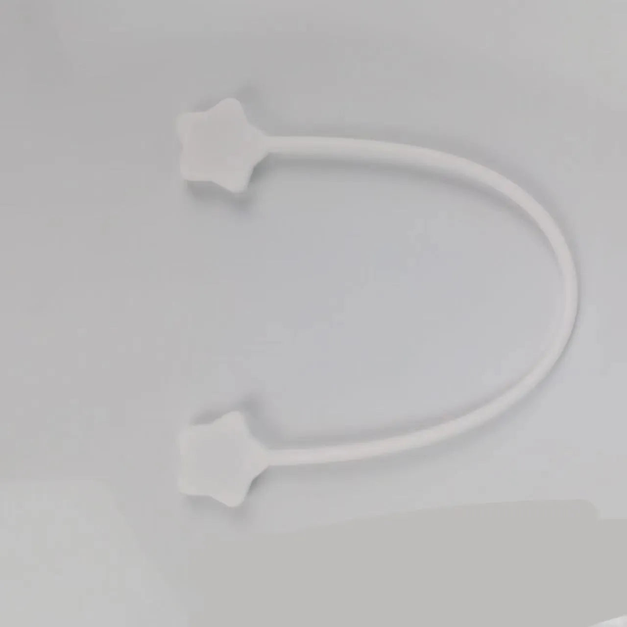 Silicone cable winder with magnet in assorted colours on a white background