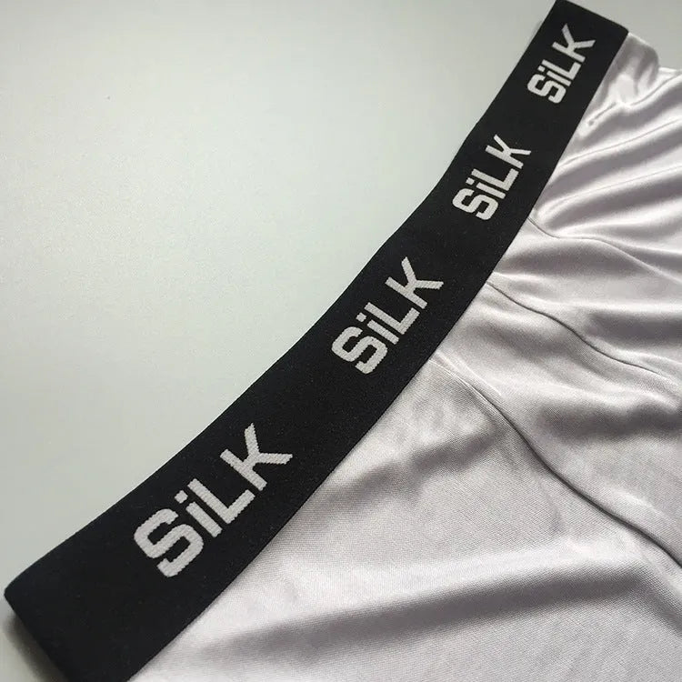 Men's loose fit silk shorts in navy blue, silver grey, and skin colour options