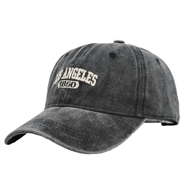 Retro personalised distressed embroidered peaked cap in beige colour with adjustable strap and conical crown.