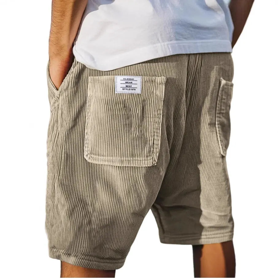 Men's grey corduroy shorts with multiple pockets and straight-leg cut on a neutral background.