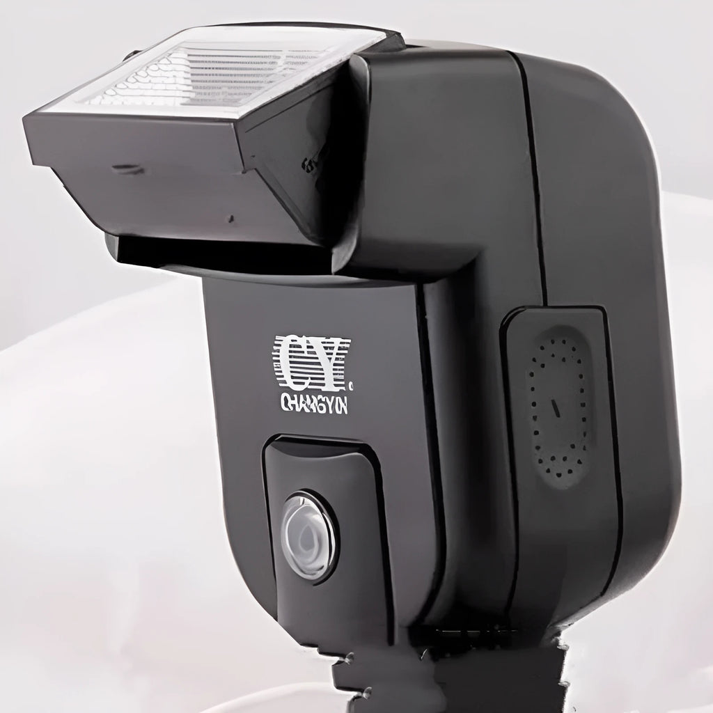 Silver hot shoe camera flash unit with head tilted upwards, shown mounted on an SLR camera