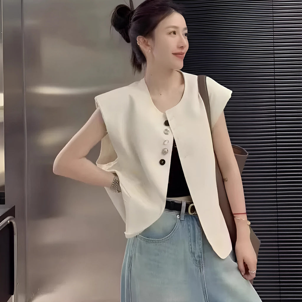 Women's polyester vest in milky white with pocket detail and loose fit design