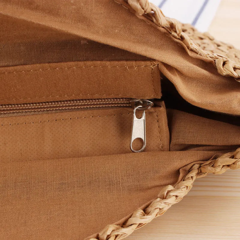Medium beige straw round shoulder bag with woven finish and zip closure