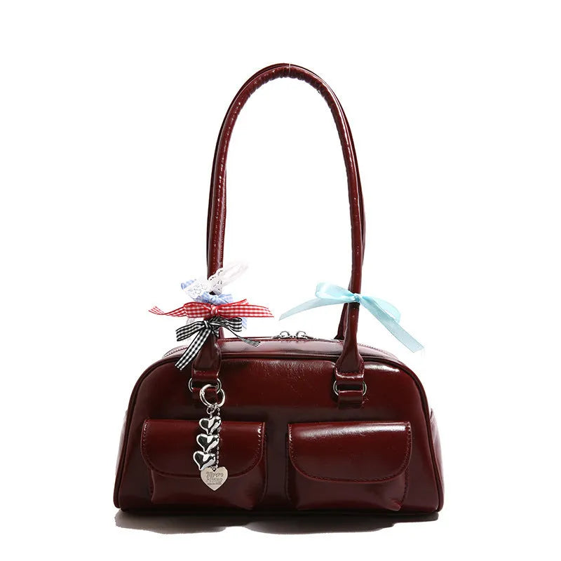 Retro pillow-shaped women's handbag in PU leather with double shoulder strap, shown in black colour
