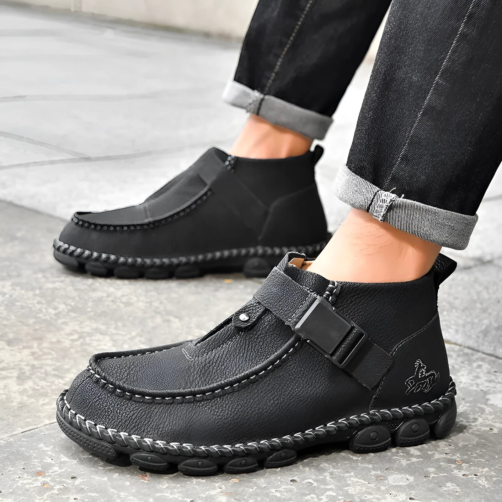 Men's black handmade stitching slip-on casual flat shoes with a low heel.