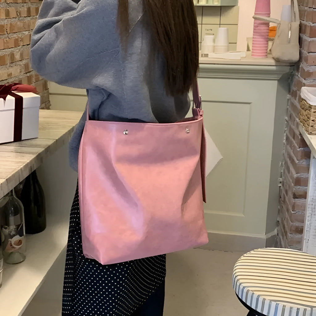 Corduroy tote bag with one-shoulder strap in pink colour showing structured dimensions and PU-lined interior