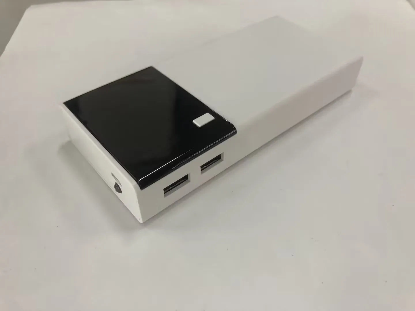 Black Rice 20000mAh power bank with charging cable, compact plastic shell design