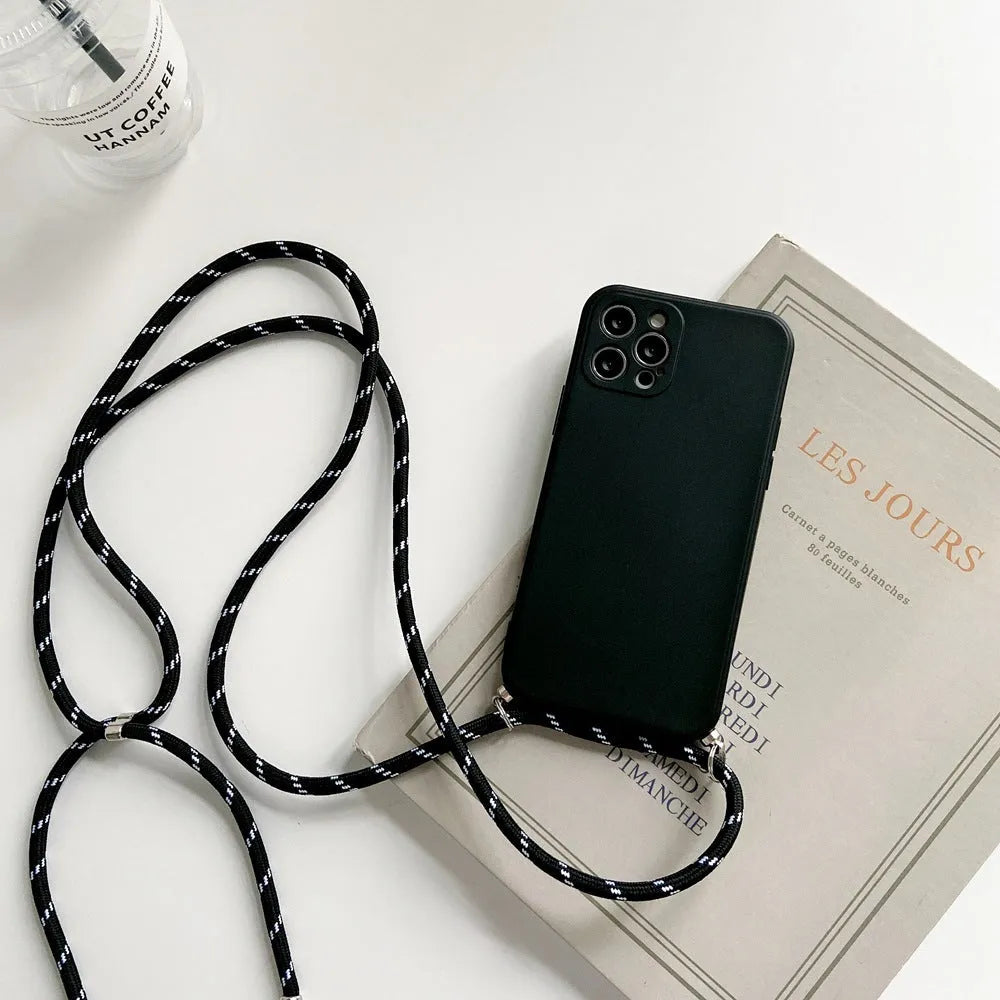 Liquid silicone phone case with crossbody lanyard for iPhone 13 Pro in black, showing rear cover and attached strap