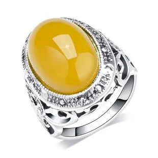 Geometric alloy ring with antique silver amber electroplated finish on a grey background.