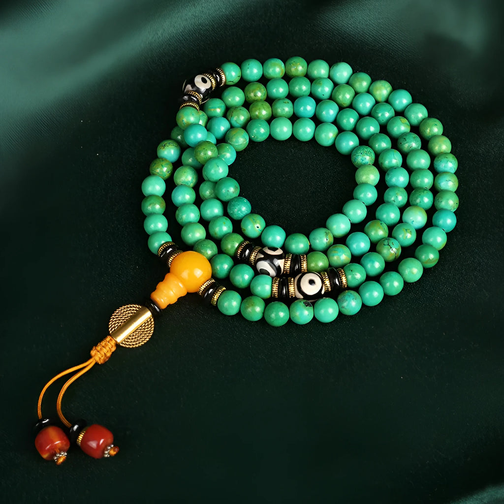 Natural turquoise gemstone bracelet with 108 round 8mm polished beads on a string.