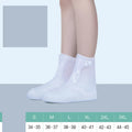 White PVC high top women's water resistant shoe covers with anti-skid soles shown in size options