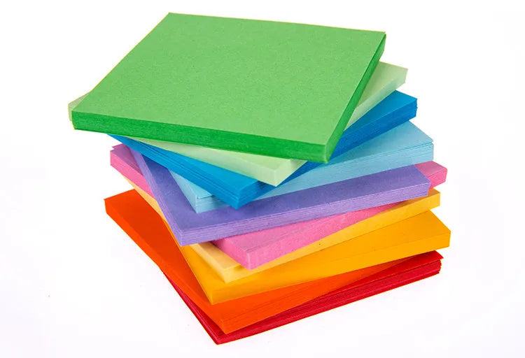 Assorted coloured miniature paper scrolls for drift bottle messages, showing pre-punched hole.