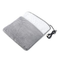 Grey USB heating feet warmer with cord and mechanical switch on floor