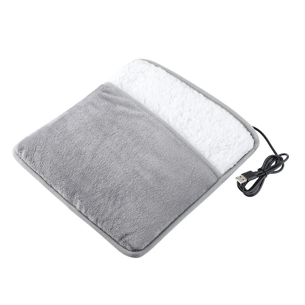 Grey USB heating feet warmer with cord and mechanical switch on floor