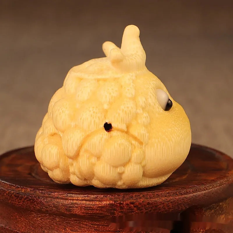 Solid bamboo carving of a cute Crown Princess toad ornament with 5.0 live eye detail.