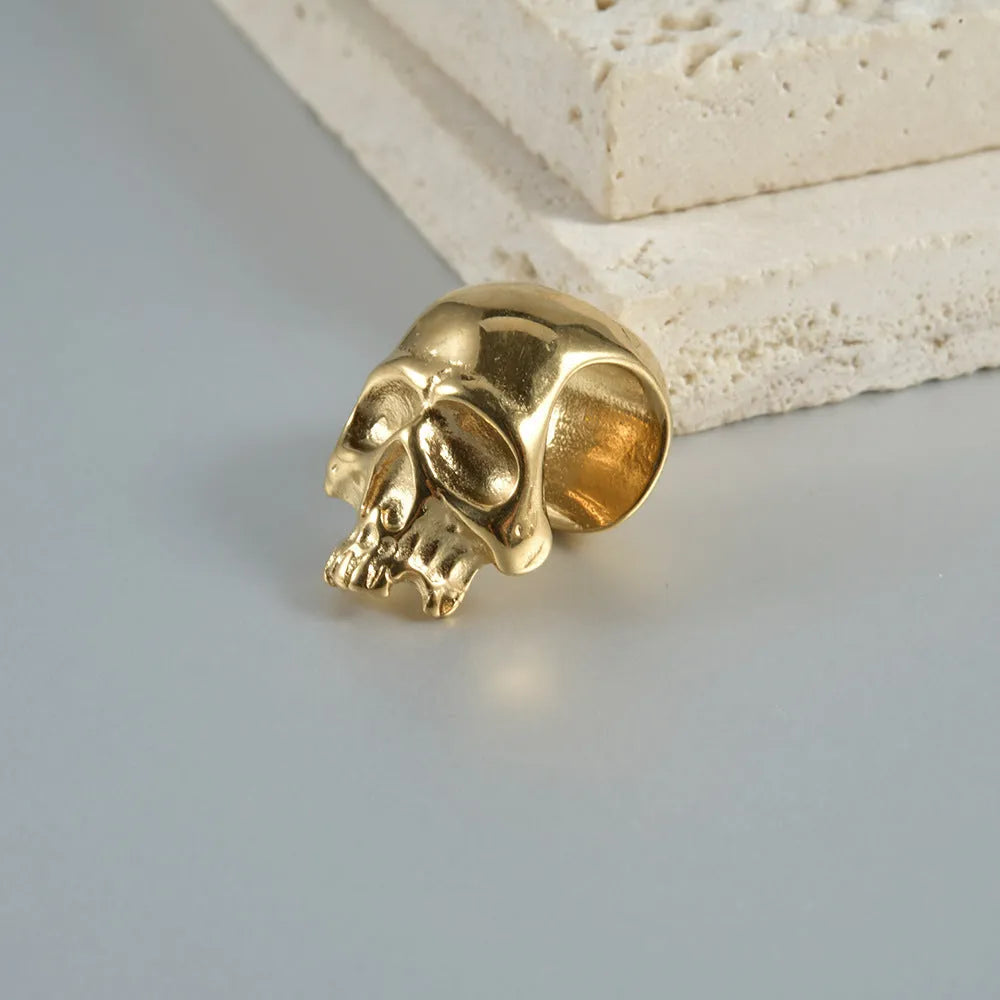 Stainless steel hollow skull Buddha earrings showing geometry shape and electroplated colour options