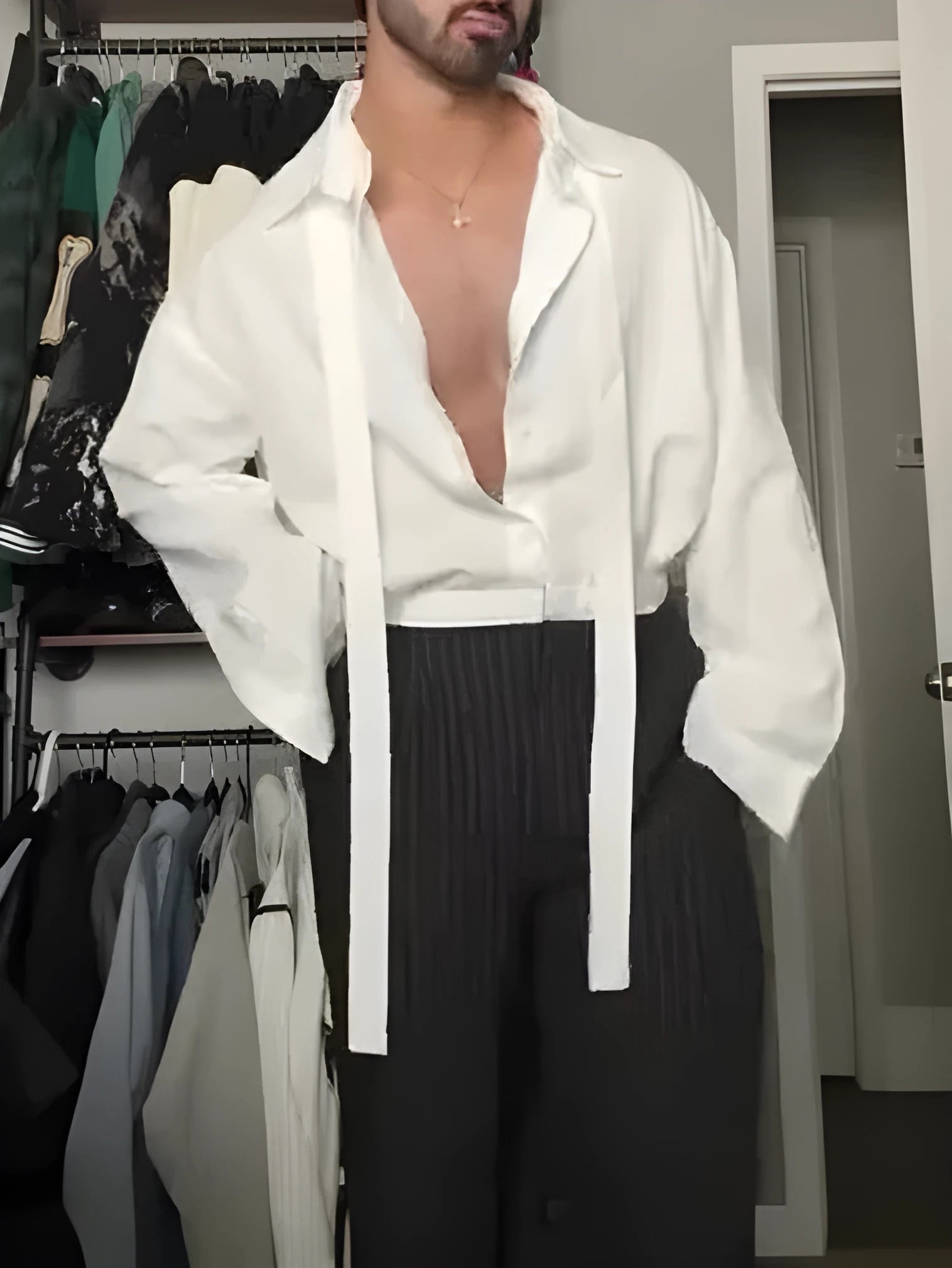 White oversized tie-front shirt with relaxed fit, open collar, and regular-length cut on a plain background