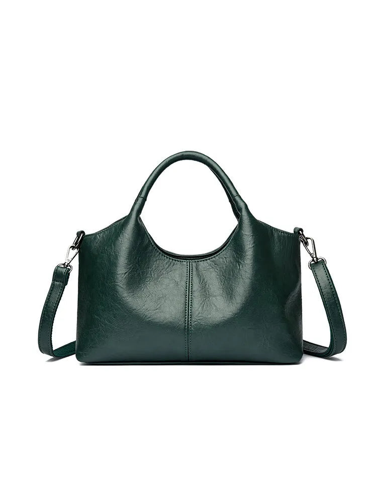 Women's genuine leather crossbody bag in beige colour showing soft construction and large capacity