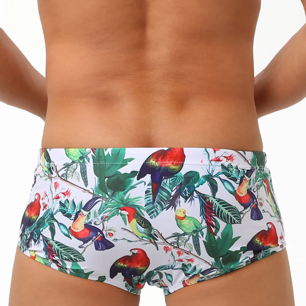 Men's navy swim trunks with white and red flower-bird print pattern, boxer briefs style