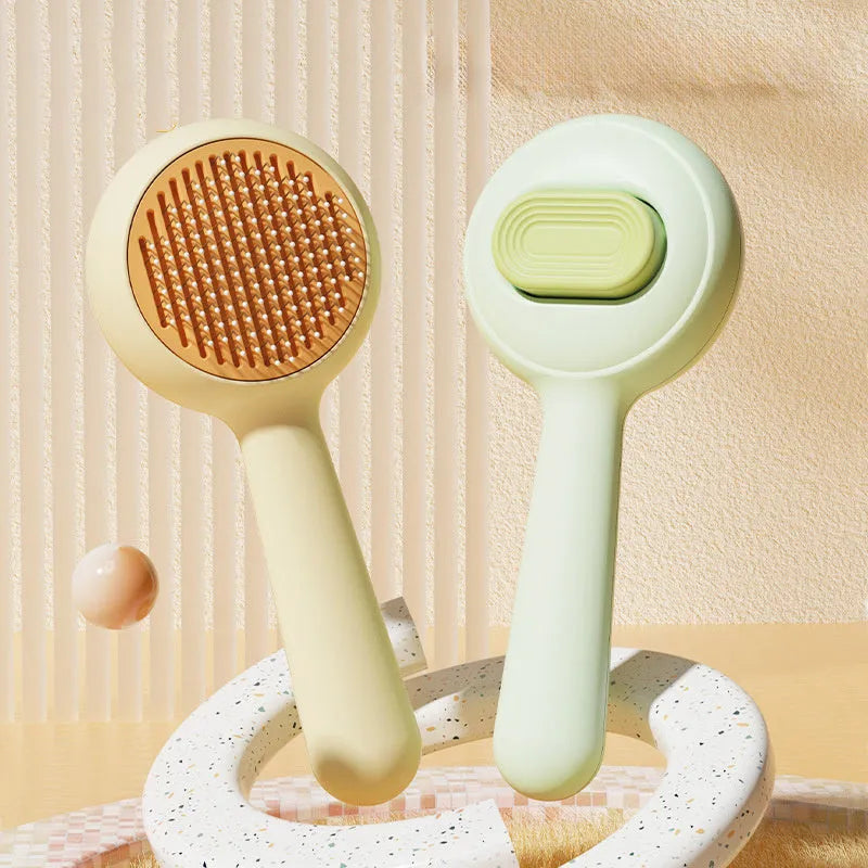 Cat grooming brush with stainless steel teeth and non-slip handle in green and yellow colours