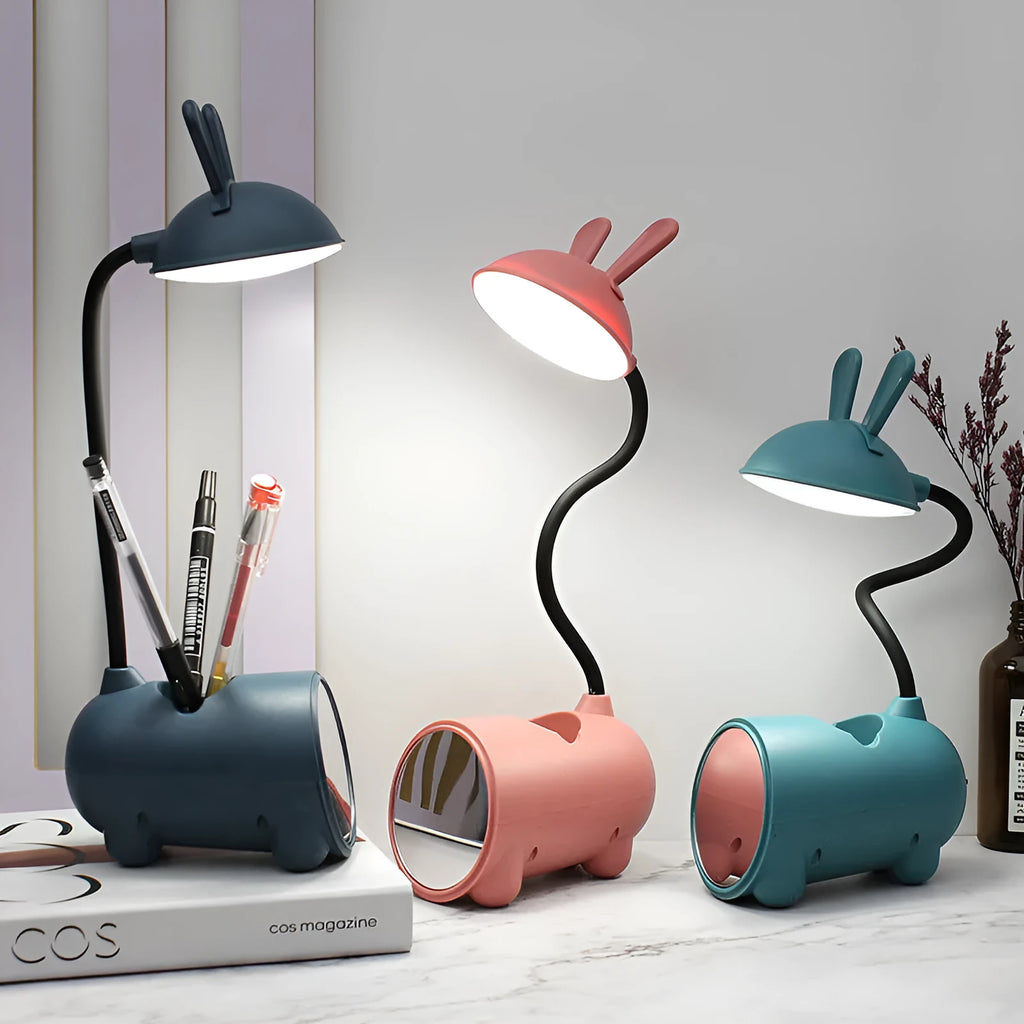 Cartoon-style USB desk lamp with integrated pen holder in green, blue, or pink colour
