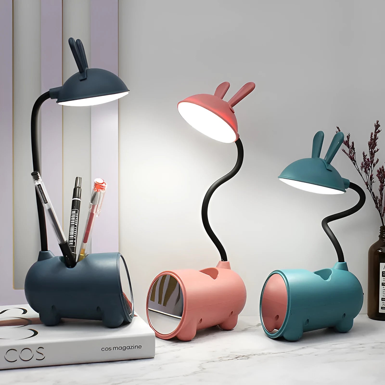 Cartoon-style USB desk lamp with integrated pen holder in green, blue, or pink colour