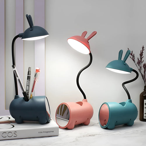 Cartoon-style USB desk lamp with integrated pen holder in green, blue, or pink colour