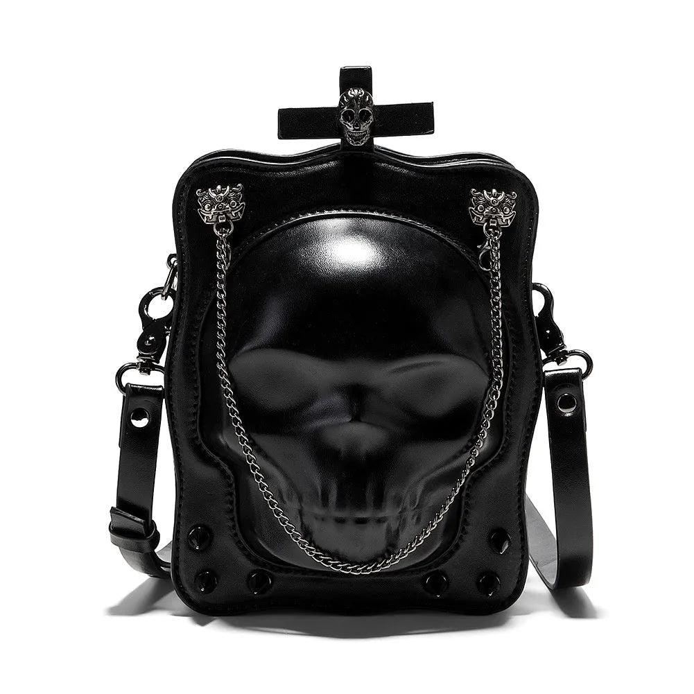 Black mini square messenger bag with embossed skull design, featuring stitching, rivets, chain details and zipper closure