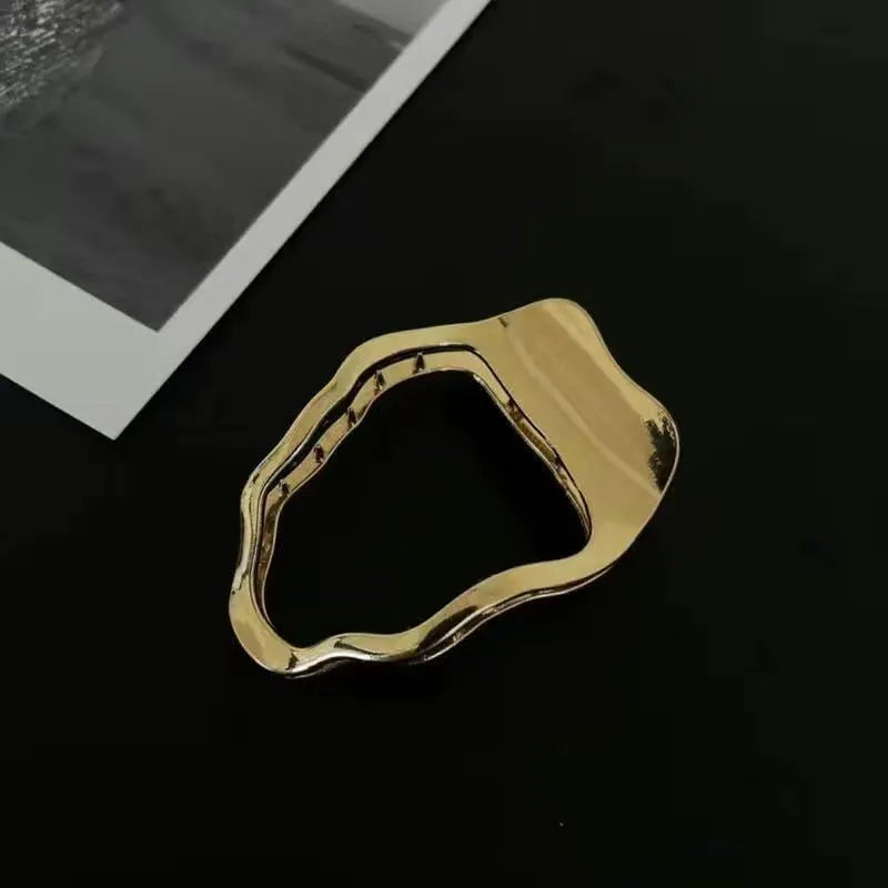 Gold and silver zinc alloy barrettes in square, arc, and triangle shapes for women
