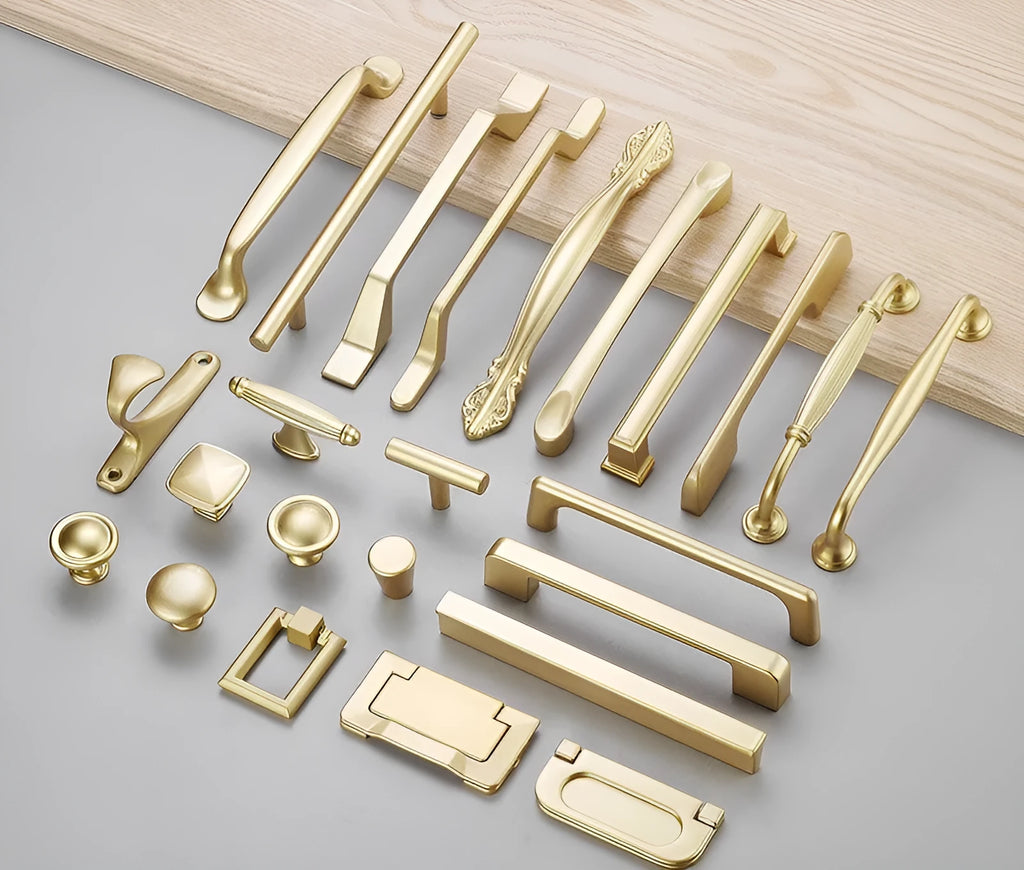 Gold T-shaped aluminium cabinet handle for single hole mounting.