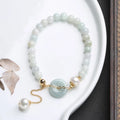 Women's jade pearl bracelet with natural emerald peace buckle and geometric national style design