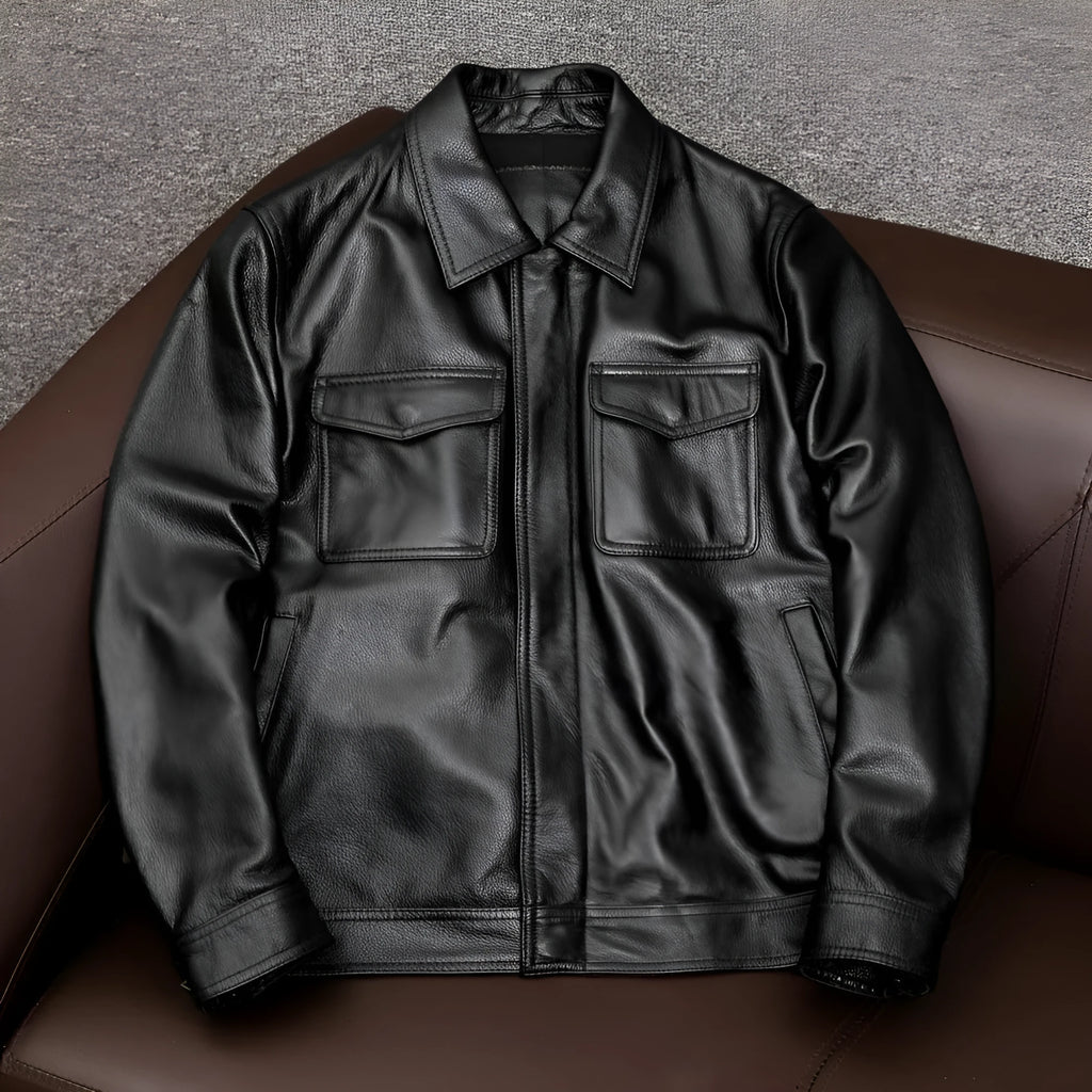Man wearing a black loose-fit lapel PU leather jacket with side pockets.