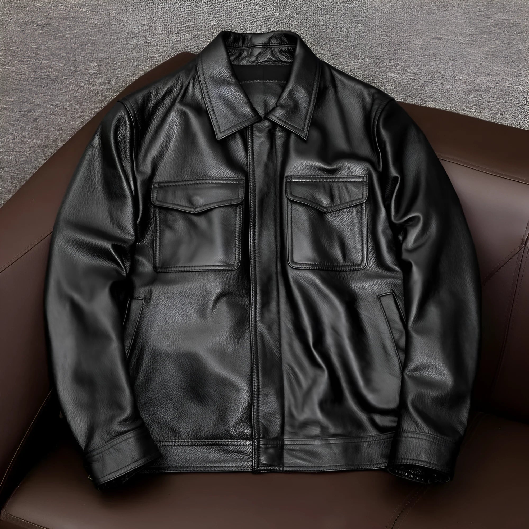 Man wearing a black loose-fit lapel PU leather jacket with side pockets.