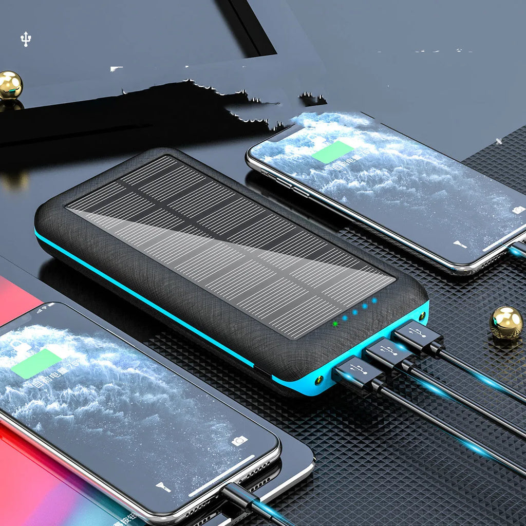 Portable power bank with wireless charging pad and three USB ports in black plastic casing