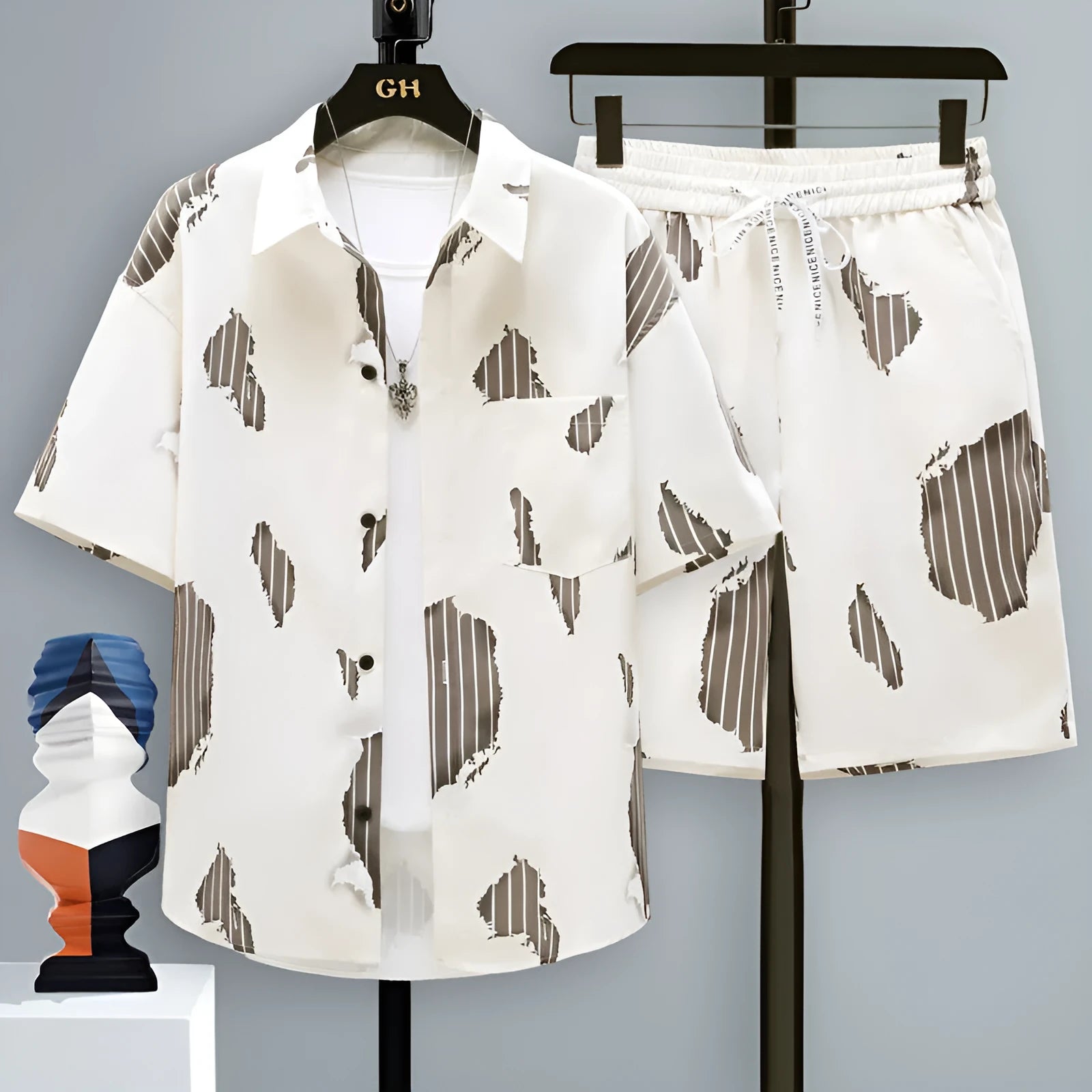 Men's grey casual polyester short sleeve top and matching shorts laid flat.