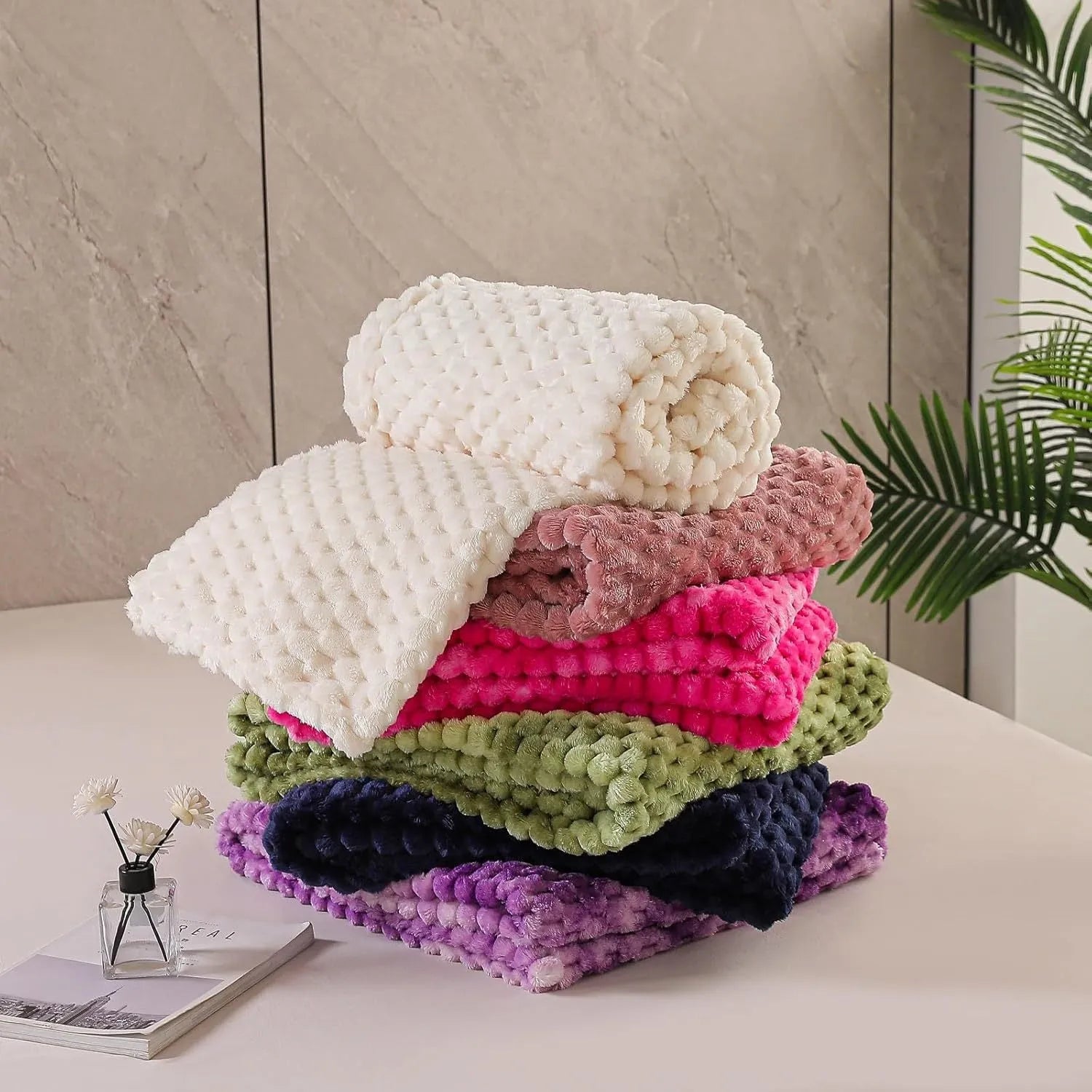 Children's soft plaid fleece blanket in camel colour showing texture and size.
