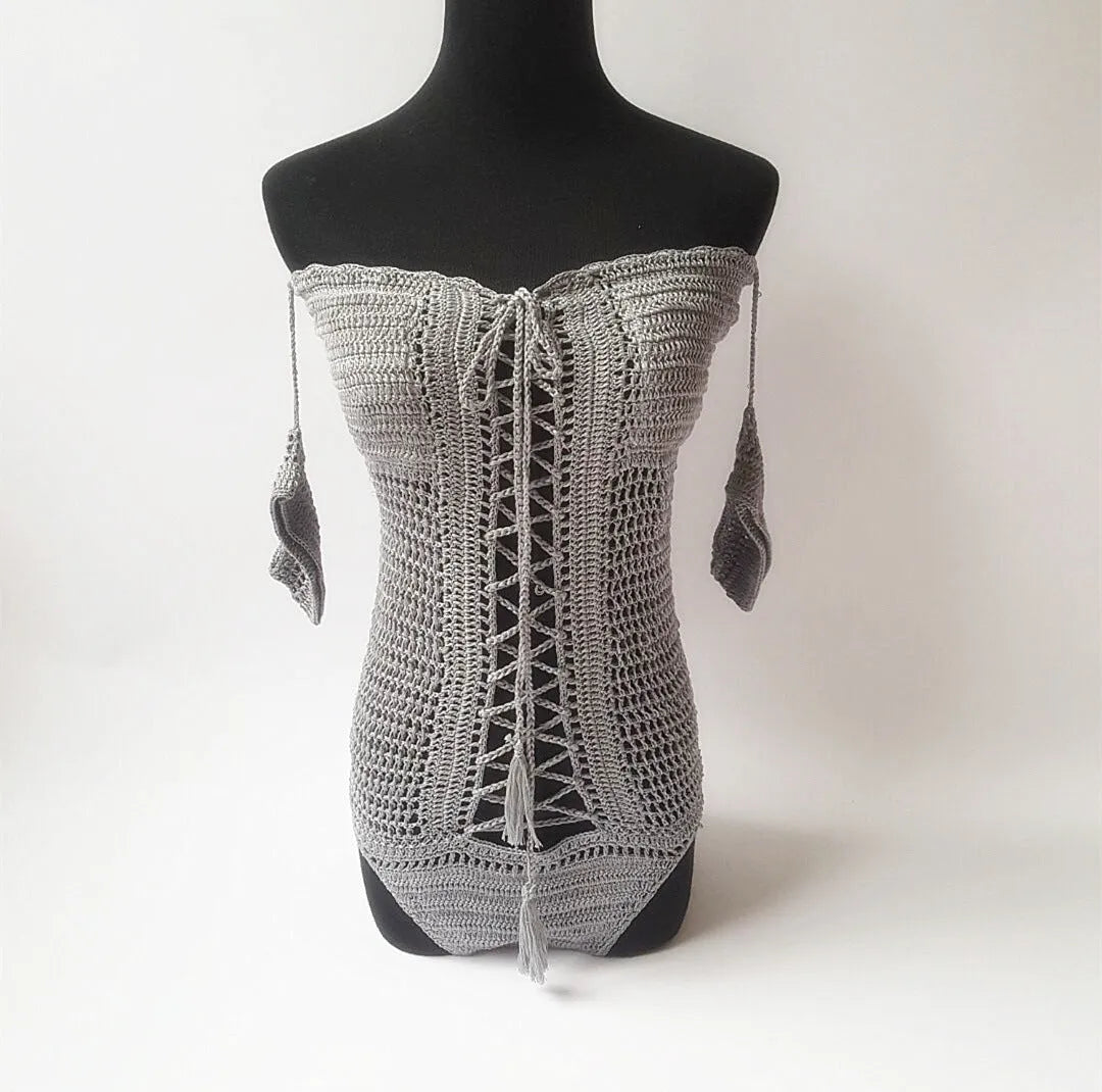 Women's off-the-shoulder one-piece swimsuit in light pink on a mannequin