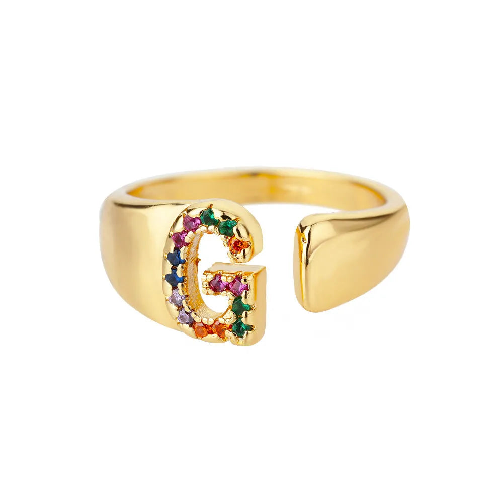 Fashion micro-set colored zirconium adjustable open ring showing letter A on a copper electroplated base