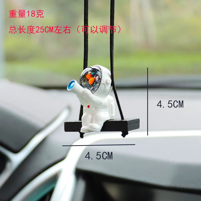 Resin astronaut car pendant in one of five cartoon colour designs