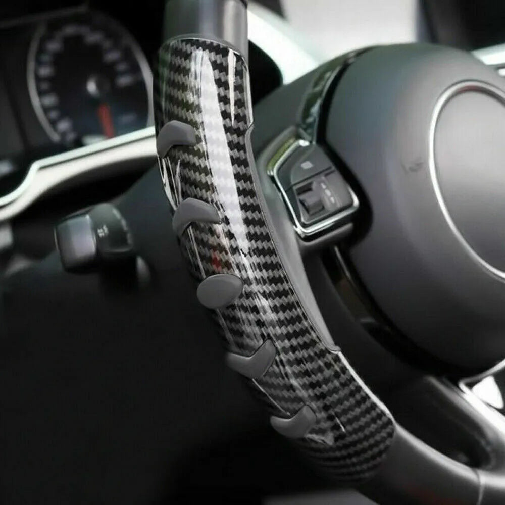 Carbon fibre black steering wheel anti-skid sleeve showing textured fibre surface and 38cm diameter measurement