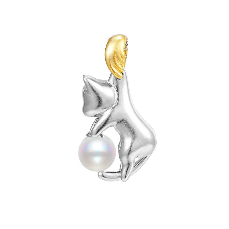 Close-up of a sterling silver cat charm clavicle chain necklace on a model.