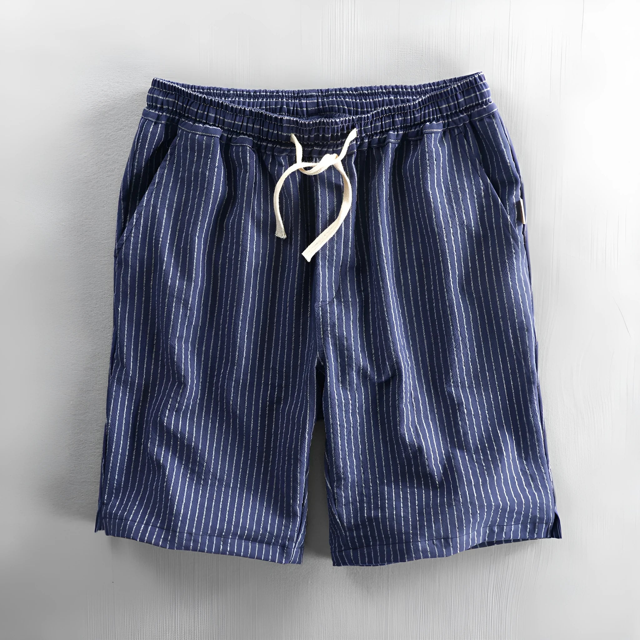 Men's striped cotton casual shorts in a loose straight fit on a mid-waist, shown in light blue colour.