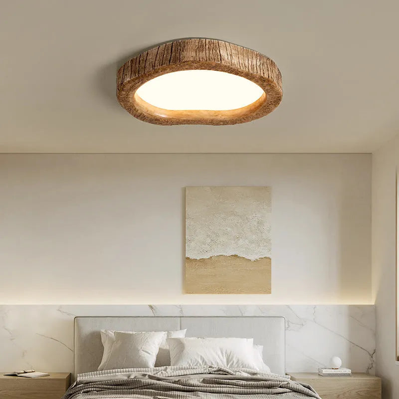 Round wood grain finish ceiling lamp in new Chinese style, flush mounted on a white ceiling.