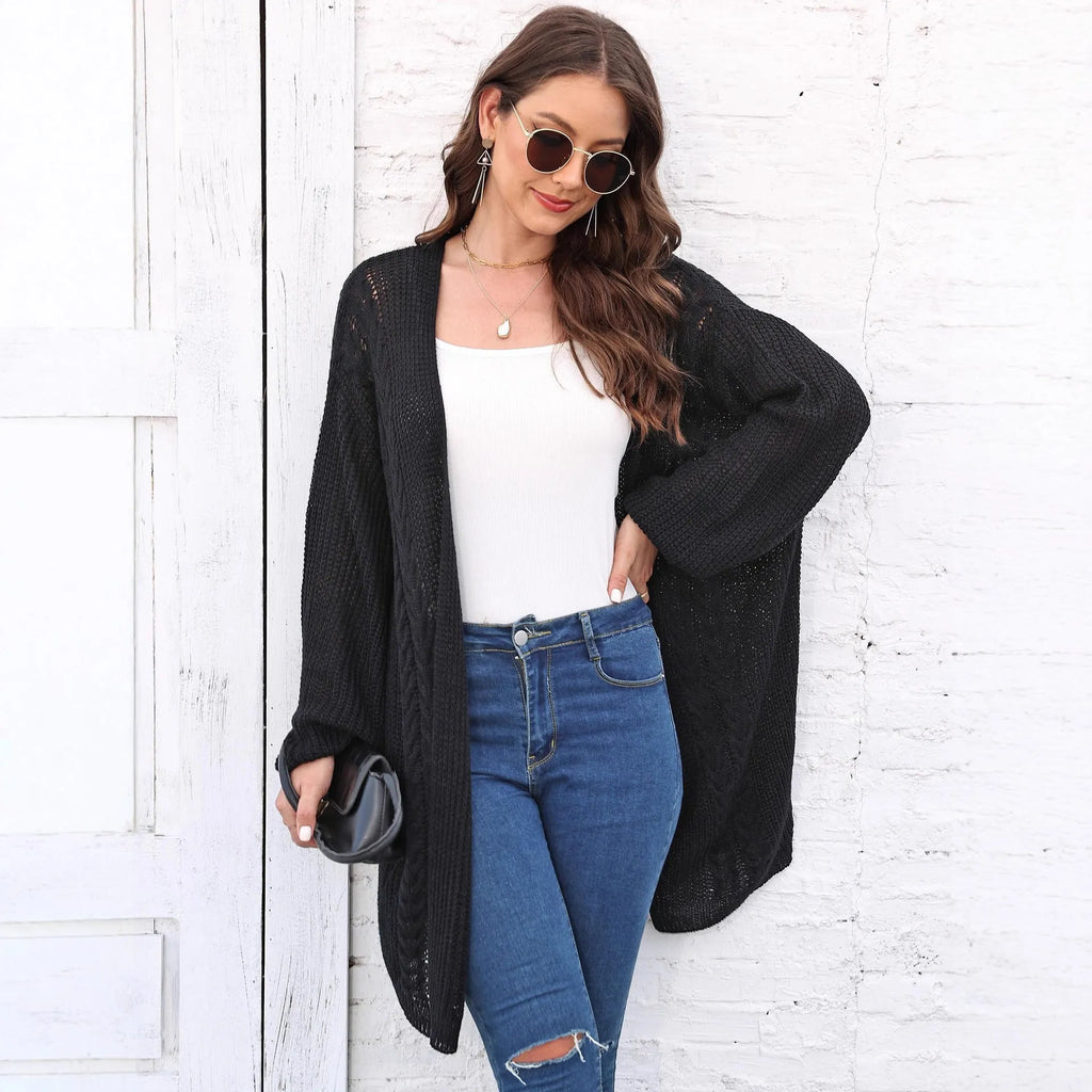 Women's loose acrylic sweater coat in solid colour on hanger