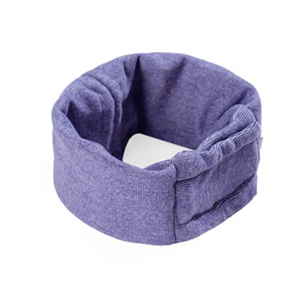 Dog wearing black calming hoodie head cover with ear wrap for noise reduction