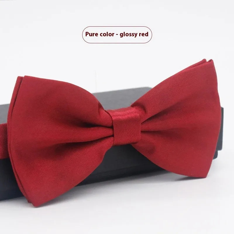 Men's flat head style polyester bow tie in a solid colour, shown with adjustable neck strap.