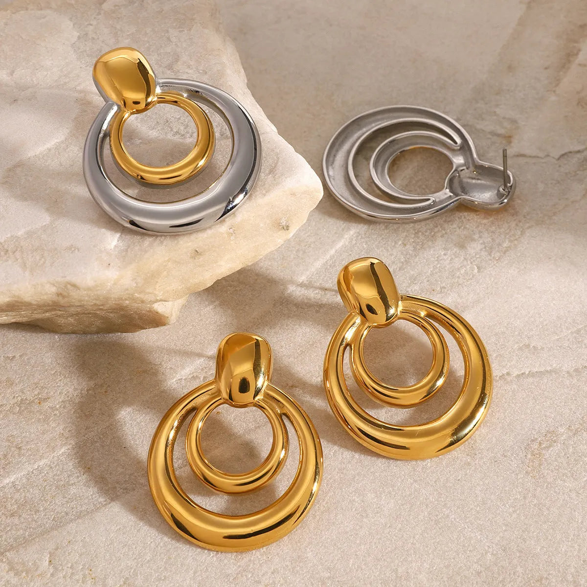 Golden round stud earrings with double-layer hollow geometric design on titanium steel