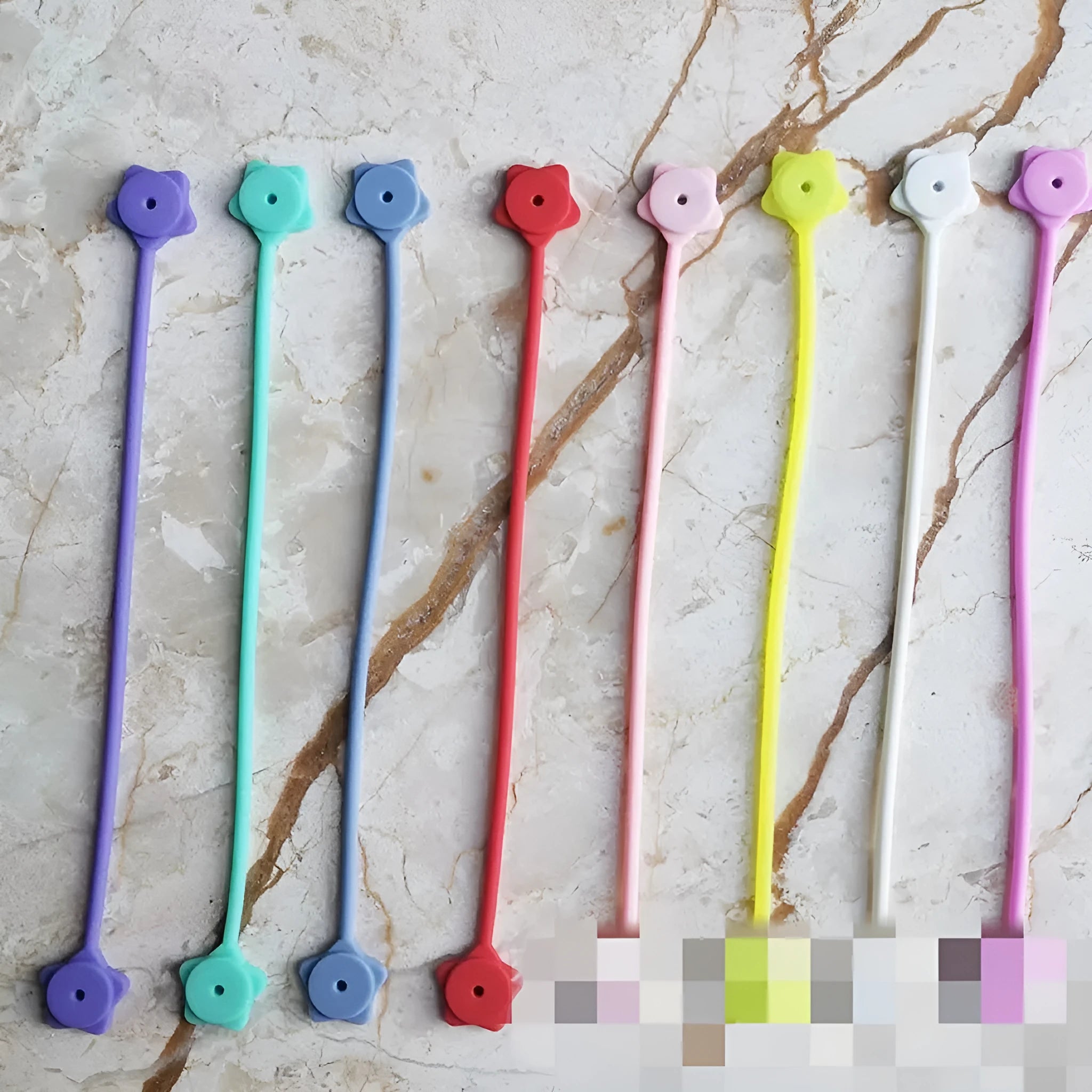 Silicone cable winder with magnet in assorted colours on a white background