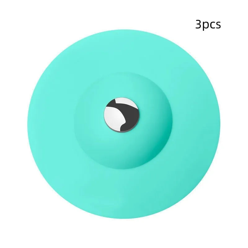 UFO-style silicone press sink drain cover in white on a modern kitchen sink