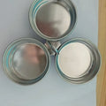 Small stainless steel heart-shaped egg steamer or cooker on a kitchen counter.